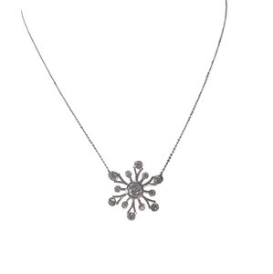 Monet Silver Snowflake- Shaped Pendant Necklace with Crystal Design.